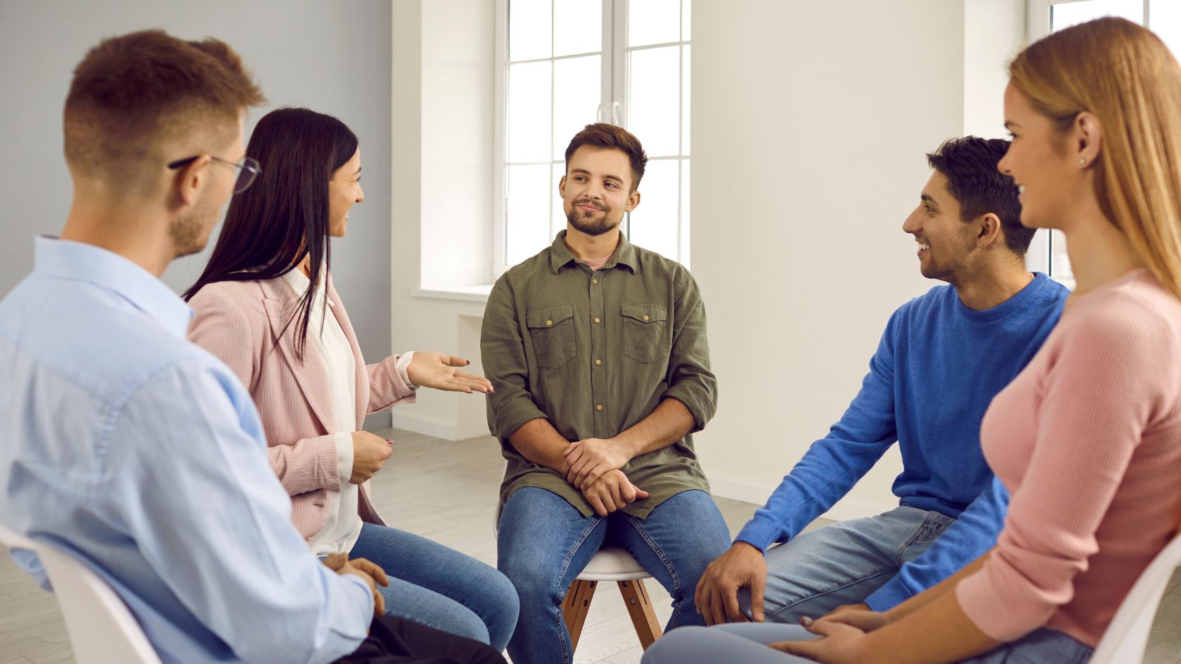 People sharing experiences during a meeting at an intensive outpatient program in Atlanta.