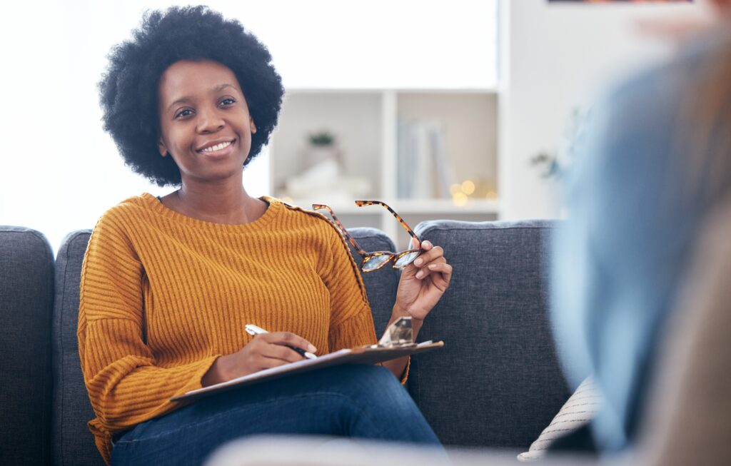 A therapist speaks to her client during mental health treatment atlanta