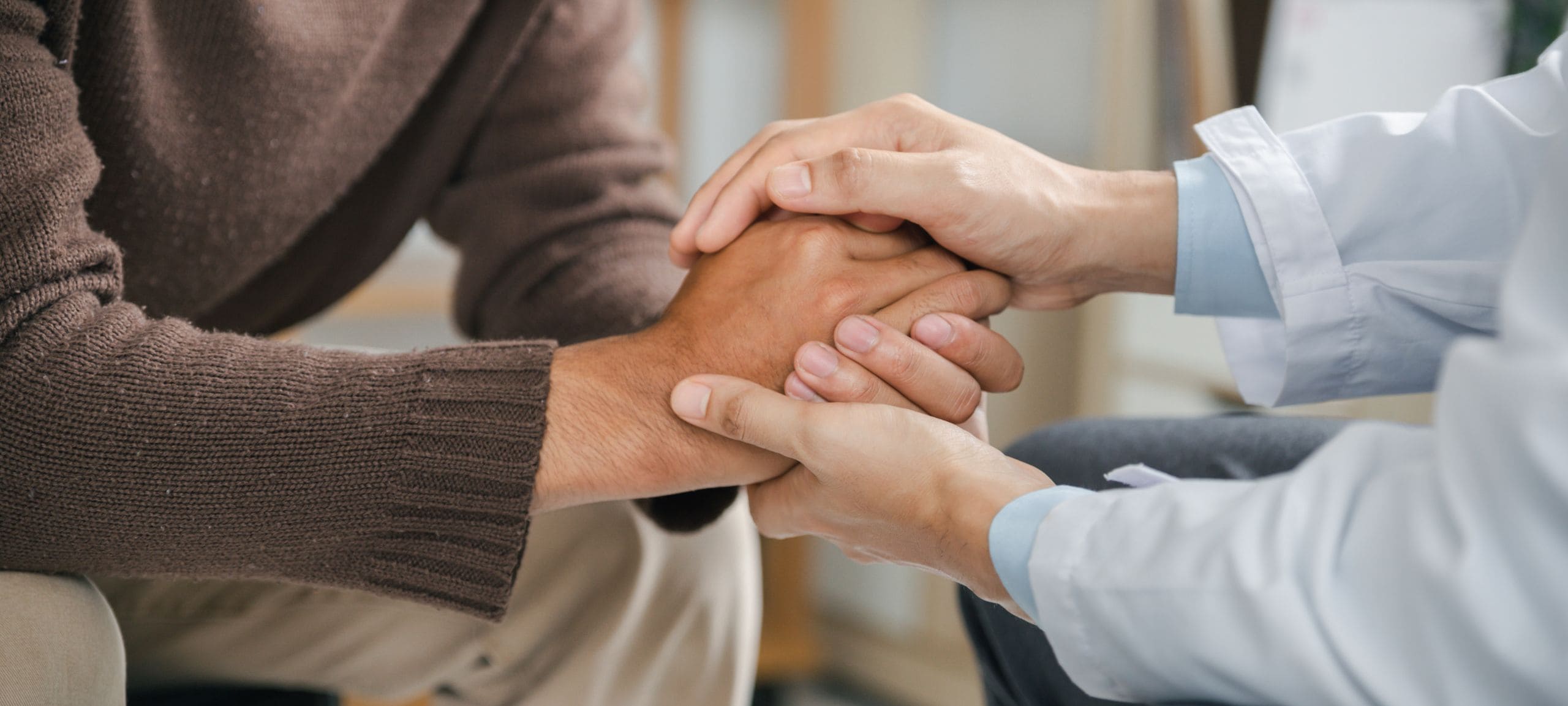 A professional offers to a client at rehab in Peachtree Corners, GA.