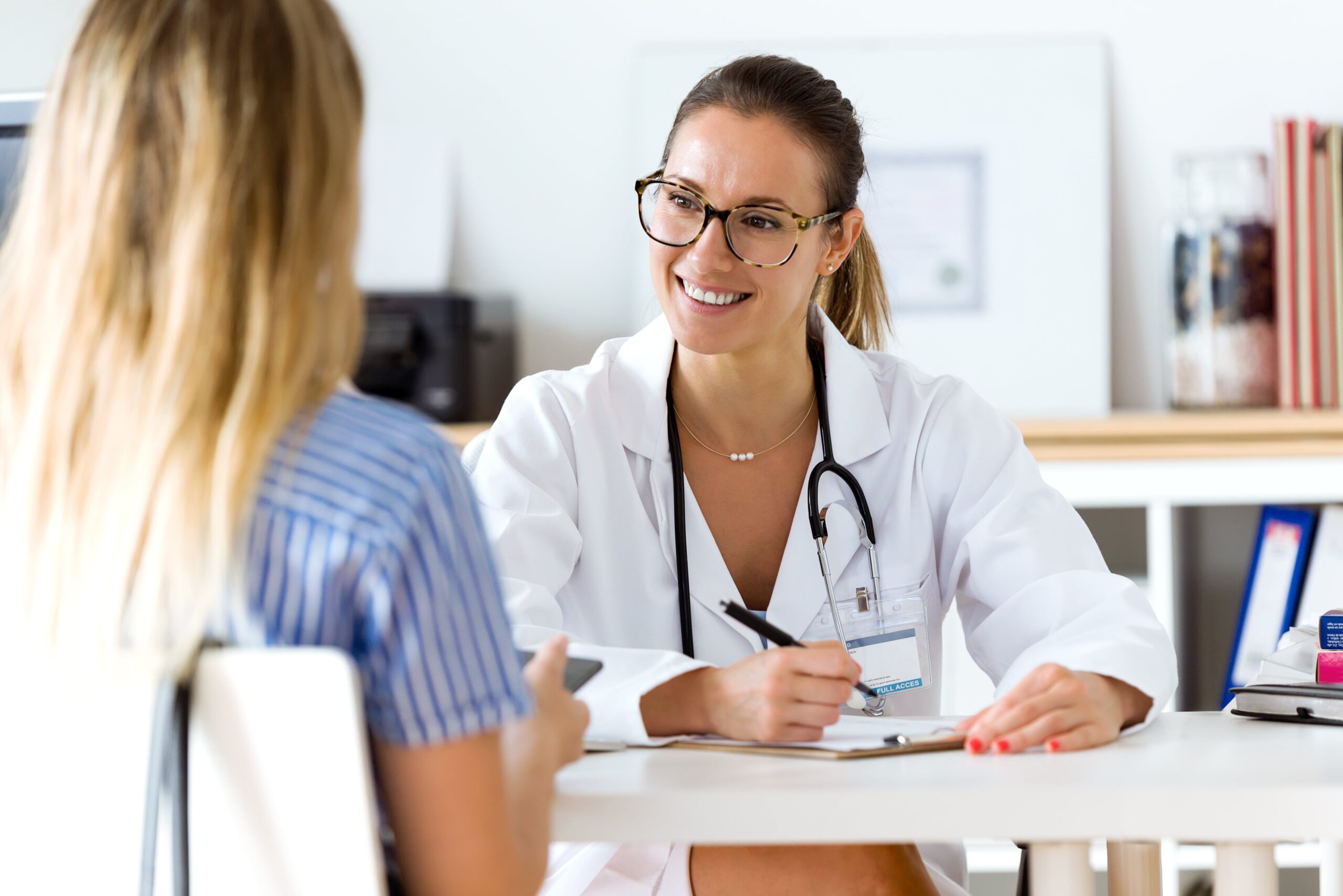 A woman discusses MAT treatment with her doctor during MAT in Atlanta 