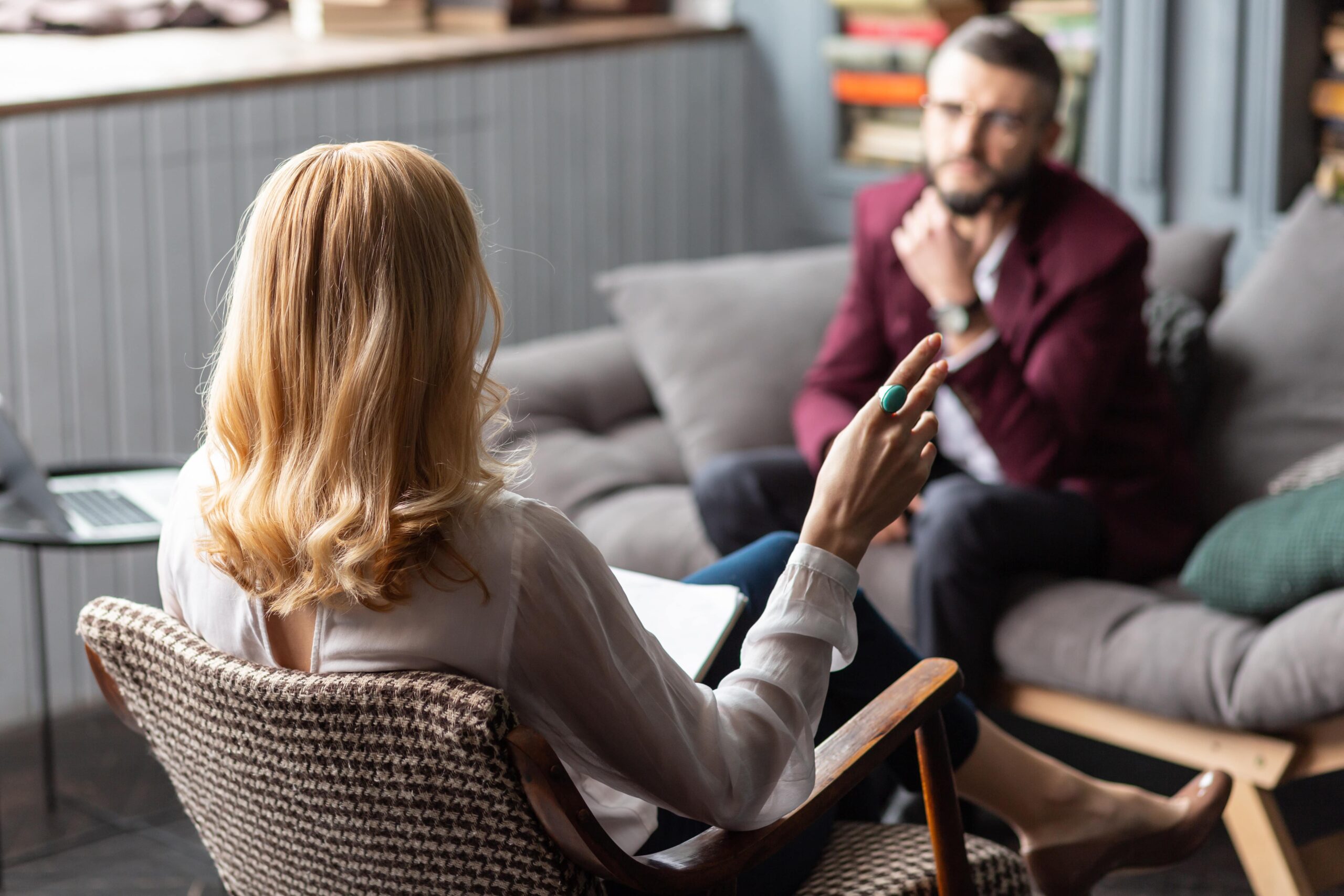 A man discusses depression treatment atlanta  with his therapist.