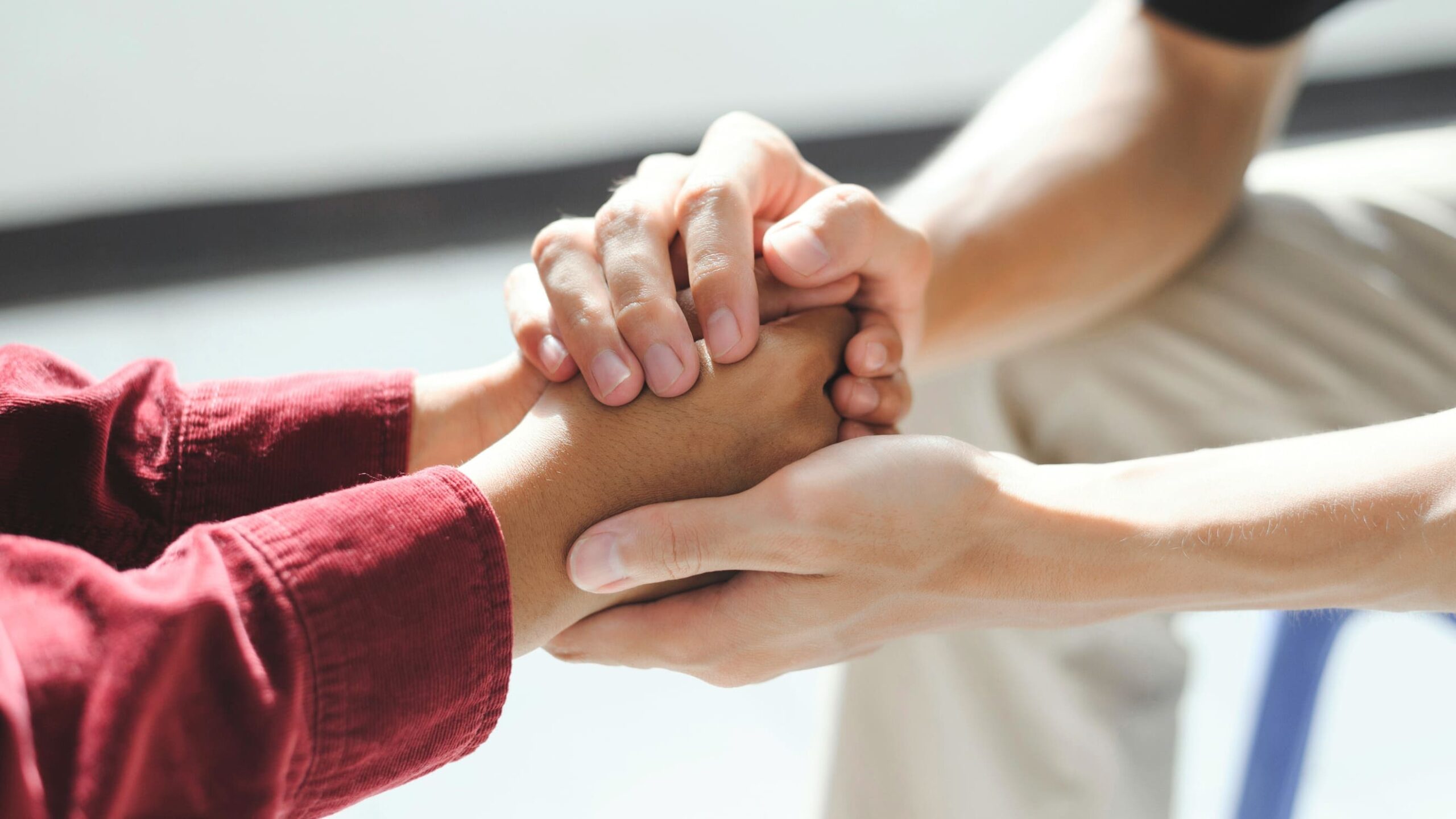 A professional offers support to a client in a session of CBT in Atlanta.