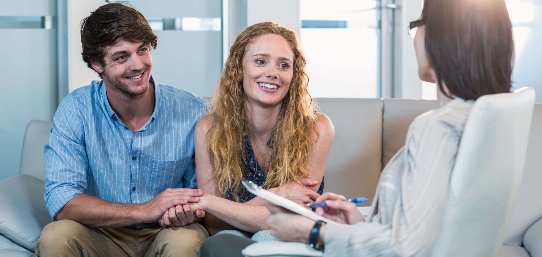 A psychiatrist offers support to a couple during medication management in Atlanta.